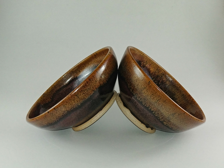 Two tenmoku bowls with grapefruit rims